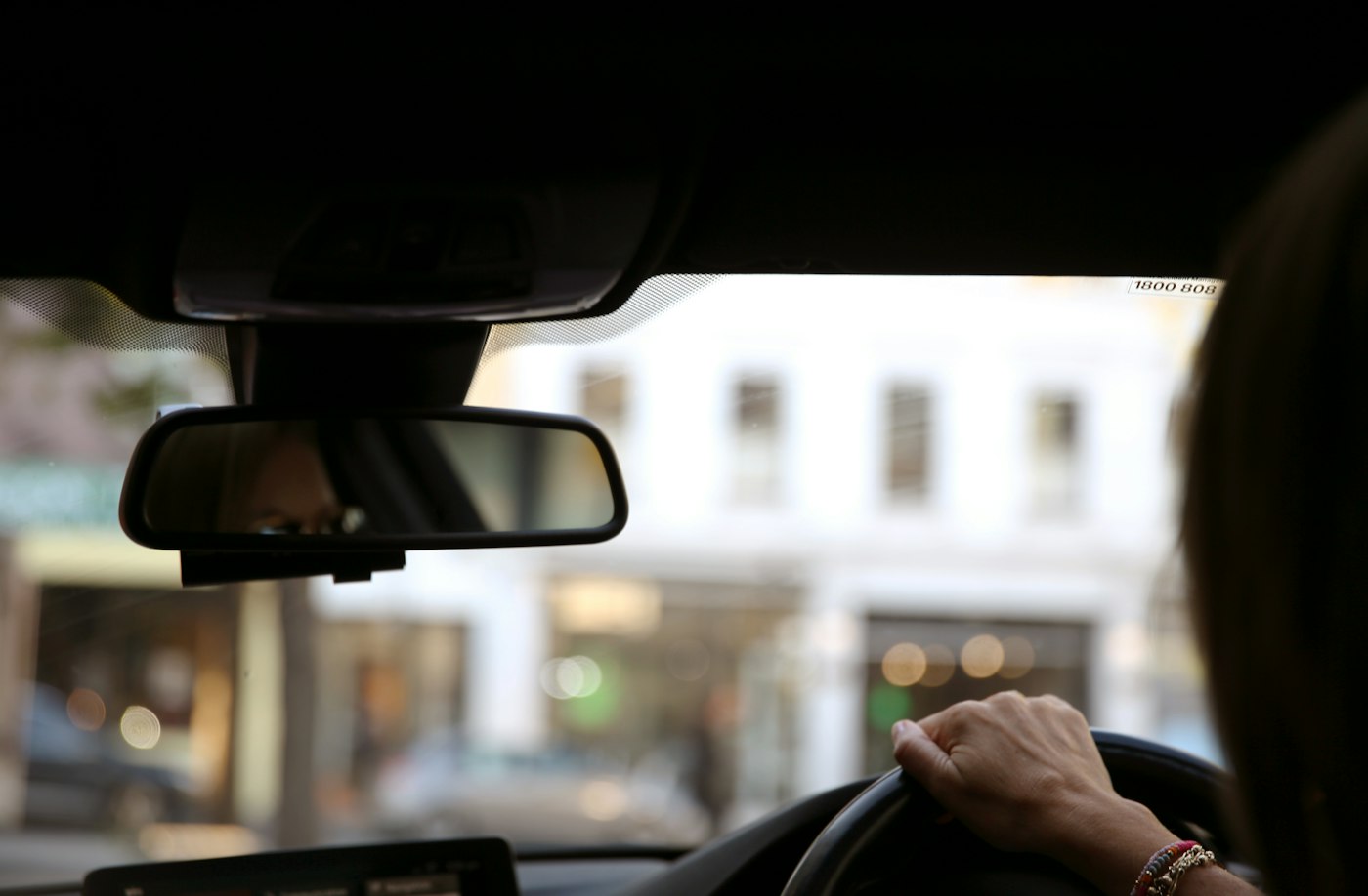 A driver at the wheel in the city